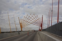 The crane extended over the bridge